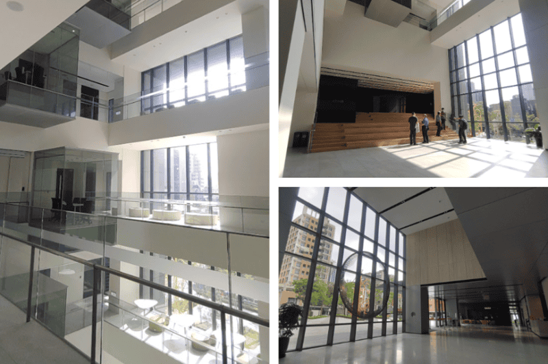 挑高大廳，一、二樓大片落地窗引進戶外自然光，沿牆邊設置流光研討室